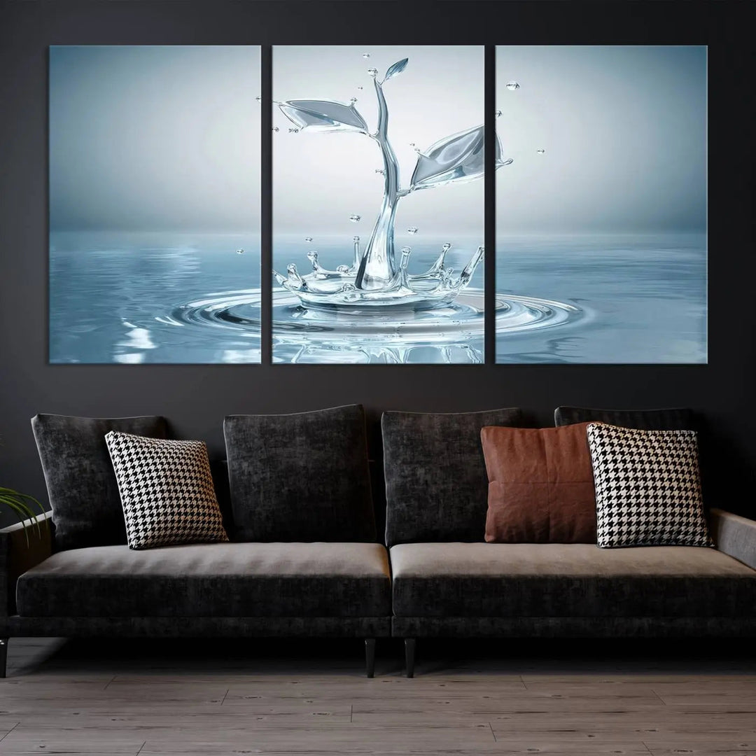 The living room features a three-panel wall art titled "Bathroom Wall Art Blue Leaf Canvas," showcasing water splash shapes that form plant-like designs on gallery-wrapped, museum-quality canvas.