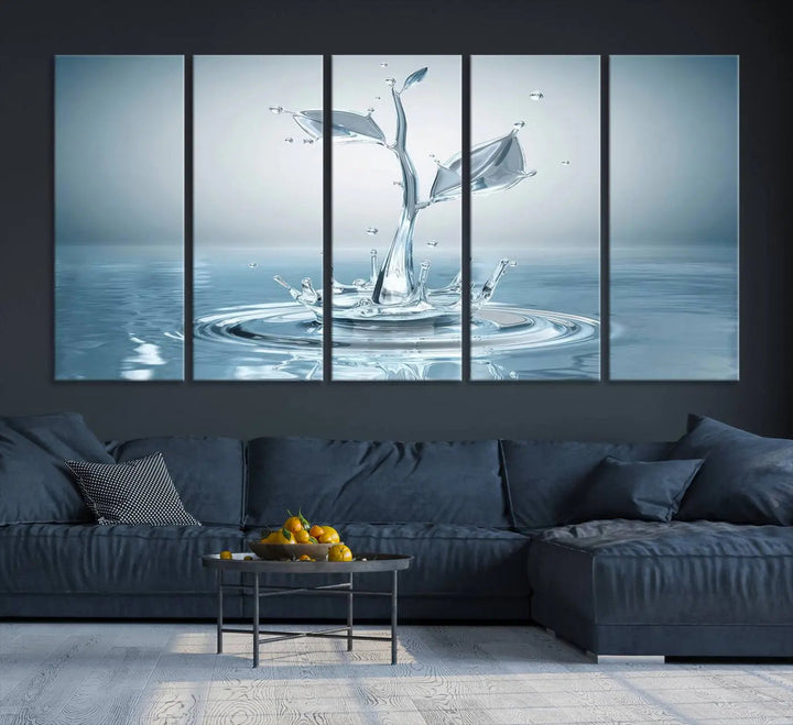 The living room features a three-panel wall art titled "Bathroom Wall Art Blue Leaf Canvas," showcasing water splash shapes that form plant-like designs on gallery-wrapped, museum-quality canvas.