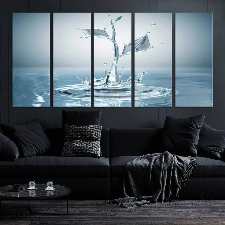 The living room features a three-panel wall art titled "Bathroom Wall Art Blue Leaf Canvas," showcasing water splash shapes that form plant-like designs on gallery-wrapped, museum-quality canvas.