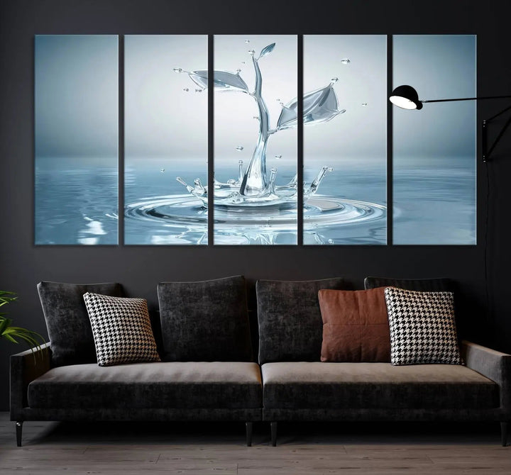 The living room features a three-panel wall art titled "Bathroom Wall Art Blue Leaf Canvas," showcasing water splash shapes that form plant-like designs on gallery-wrapped, museum-quality canvas.