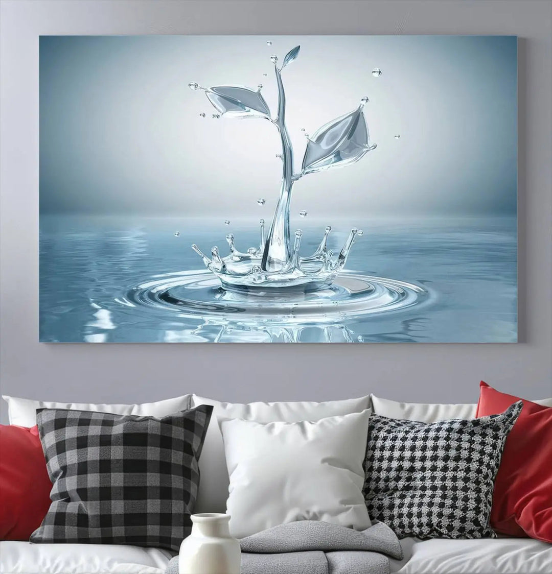 The living room features a three-panel wall art titled "Bathroom Wall Art Blue Leaf Canvas," showcasing water splash shapes that form plant-like designs on gallery-wrapped, museum-quality canvas.