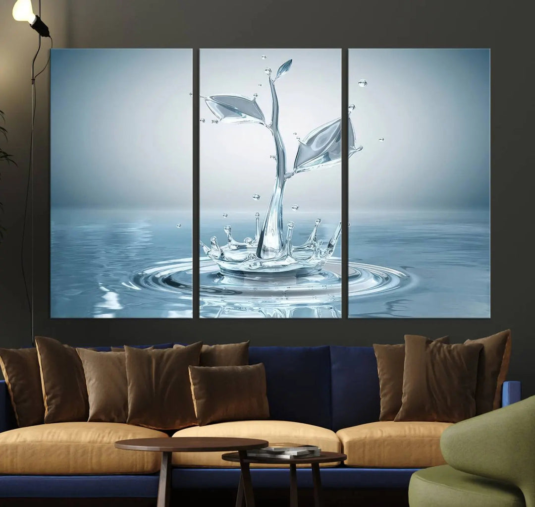 The living room features a three-panel wall art titled "Bathroom Wall Art Blue Leaf Canvas," showcasing water splash shapes that form plant-like designs on gallery-wrapped, museum-quality canvas.