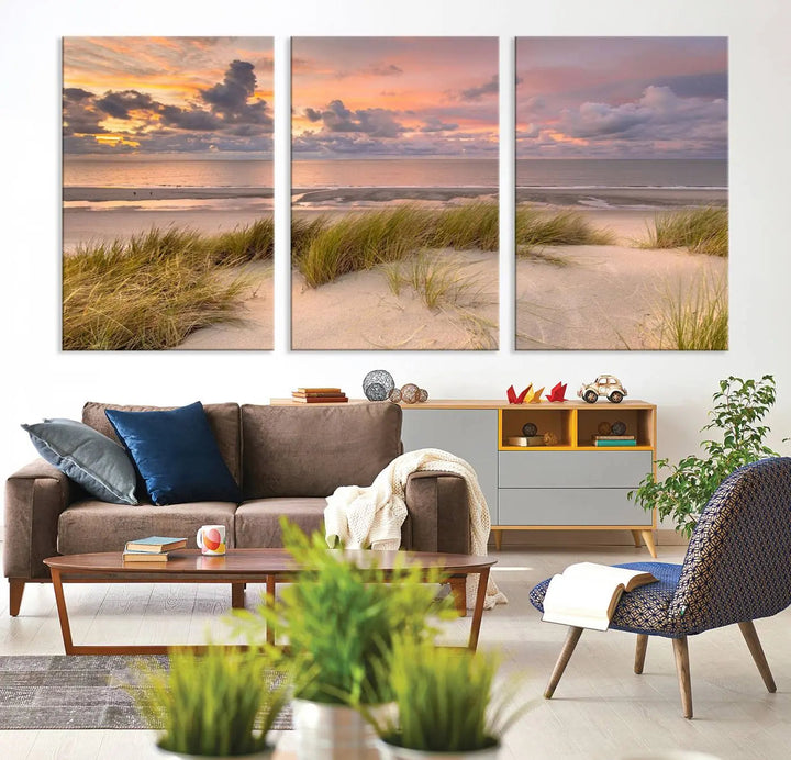 A triptych of serene sunset beach wall art graces the living room, with its museum-quality canvas accentuating the space. Each piece from the Beach Wall Art Canvas Print Sunset Artwork Print Coastal Wall Art collection comes ready to hang and features a UV-protective coating for lasting beauty.