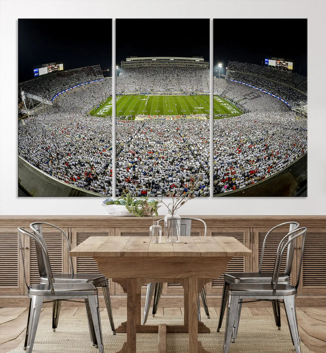 The Beaver Stadium Night Game Triple Canvas Wall Art - Penn State Nittany Lions Football Match features a panoramic view of a packed Beaver Stadium at night.