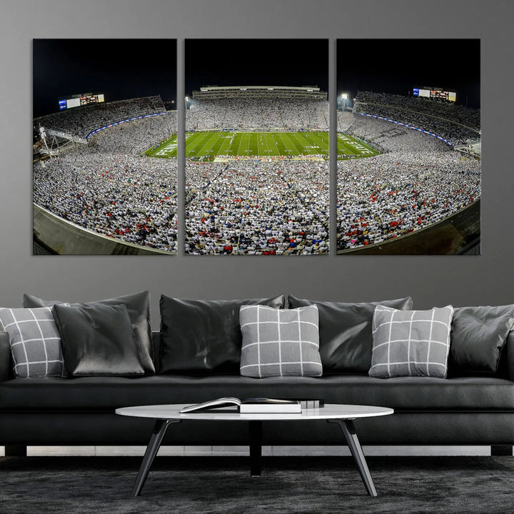 The Beaver Stadium Night Game Triple Canvas Wall Art - Penn State Nittany Lions Football Match features a panoramic view of a packed Beaver Stadium at night.