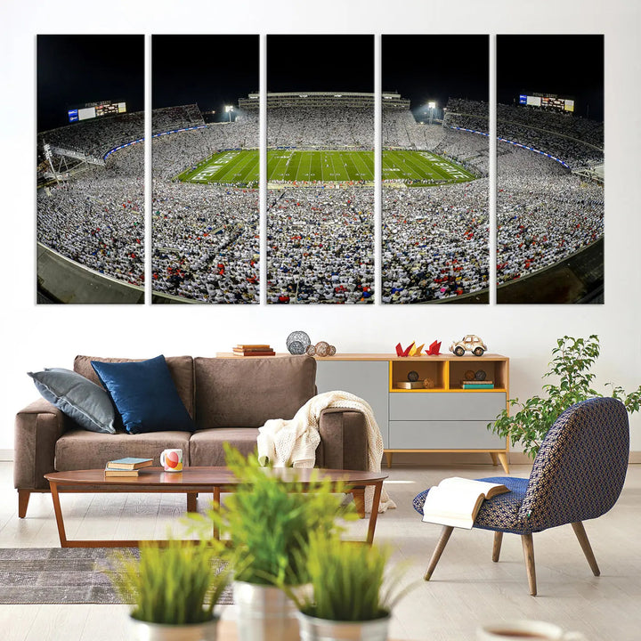 The Beaver Stadium Night Game Triple Canvas Wall Art - Penn State Nittany Lions Football Match features a panoramic view of a packed Beaver Stadium at night.