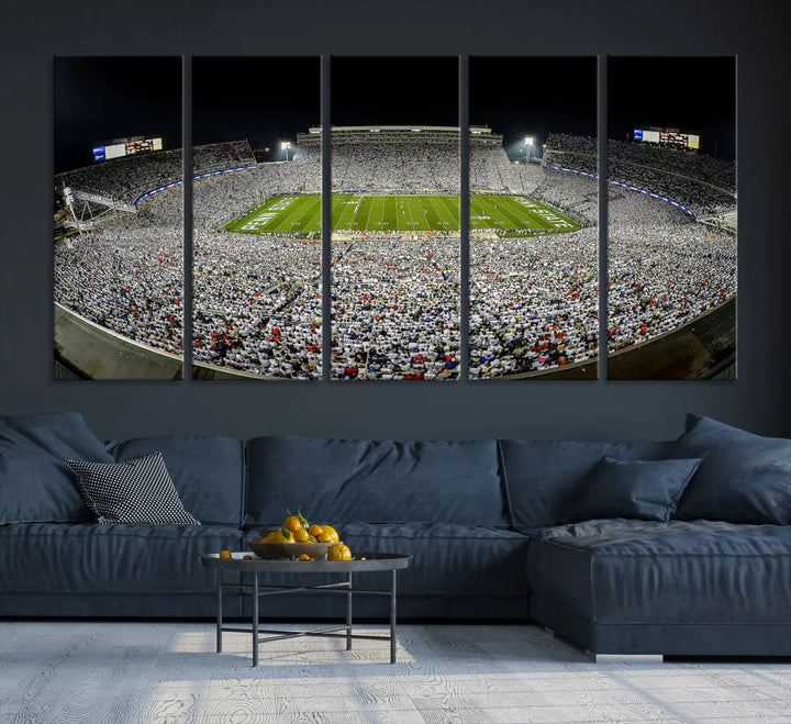 The Beaver Stadium Night Game Triple Canvas Wall Art - Penn State Nittany Lions Football Match features a panoramic view of a packed Beaver Stadium at night.