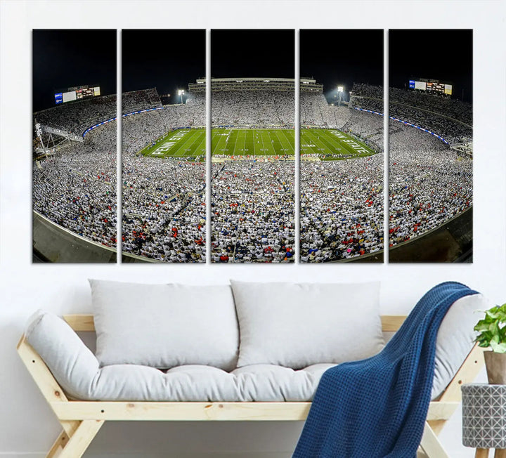 The Beaver Stadium Night Game Triple Canvas Wall Art - Penn State Nittany Lions Football Match features a panoramic view of a packed Beaver Stadium at night.