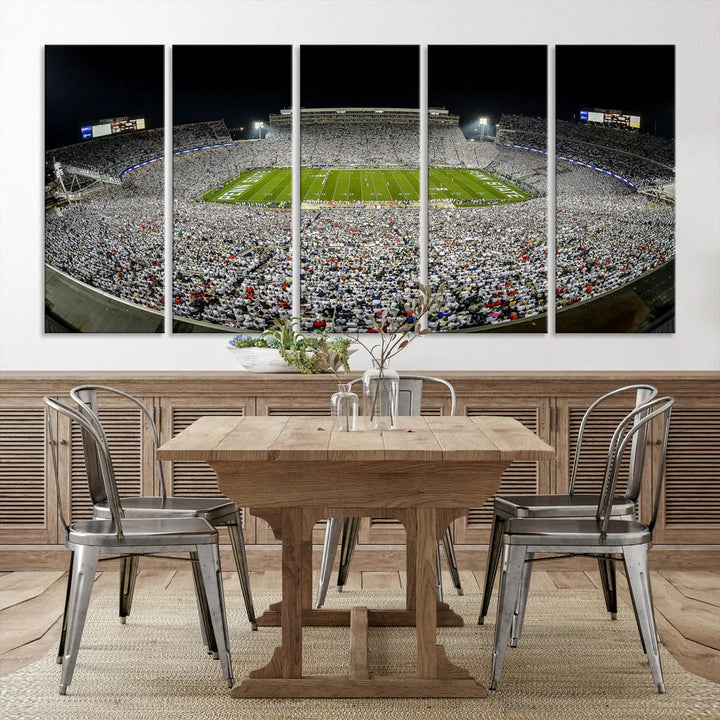 The Beaver Stadium Night Game Triple Canvas Wall Art - Penn State Nittany Lions Football Match features a panoramic view of a packed Beaver Stadium at night.