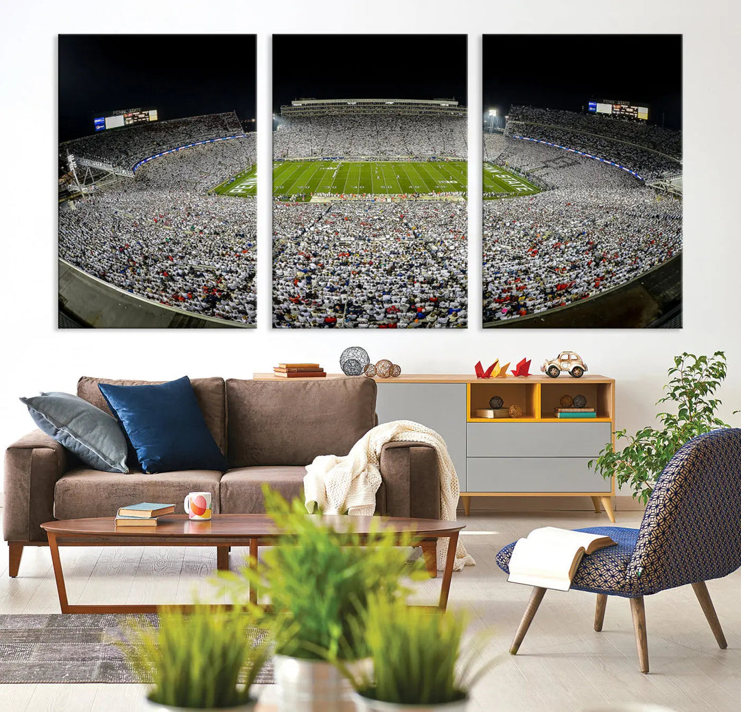 The Beaver Stadium Night Game Triple Canvas Wall Art - Penn State Nittany Lions Football Match features a panoramic view of a packed Beaver Stadium at night.