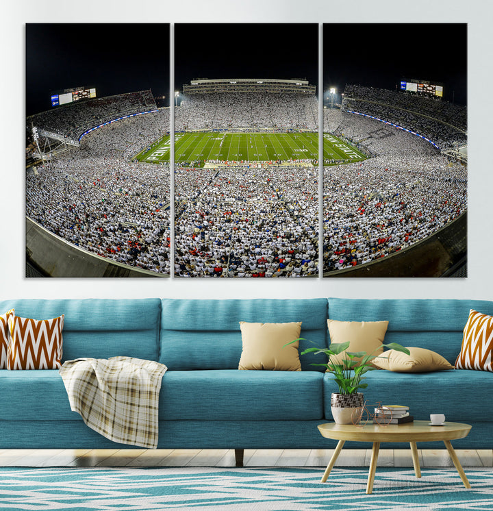 The Beaver Stadium Night Game Triple Canvas Wall Art - Penn State Nittany Lions Football Match features a panoramic view of a packed Beaver Stadium at night.