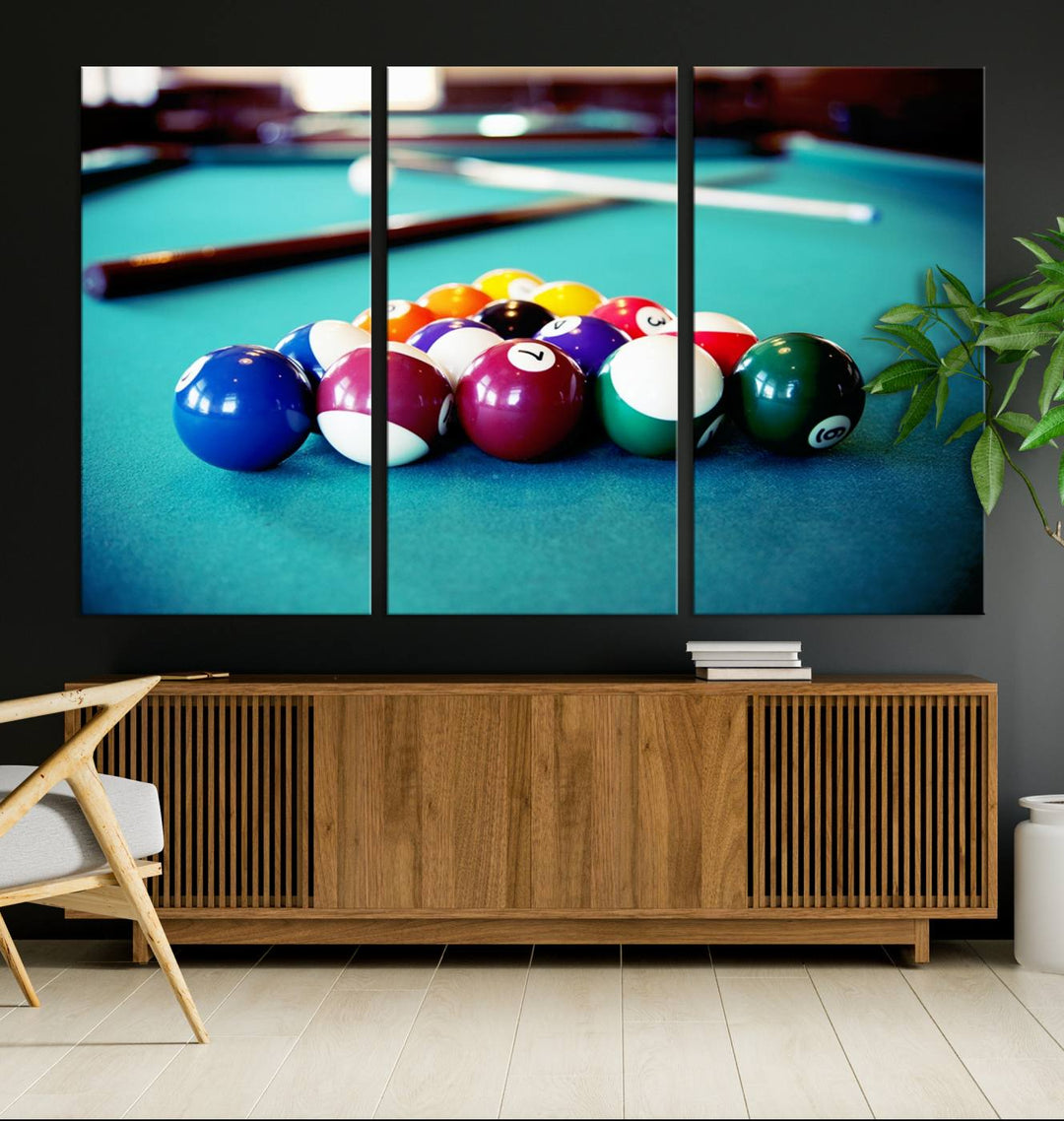 The Billiard Balls Pool Table Wall Art, a handmade piece, features cues on a blue table.