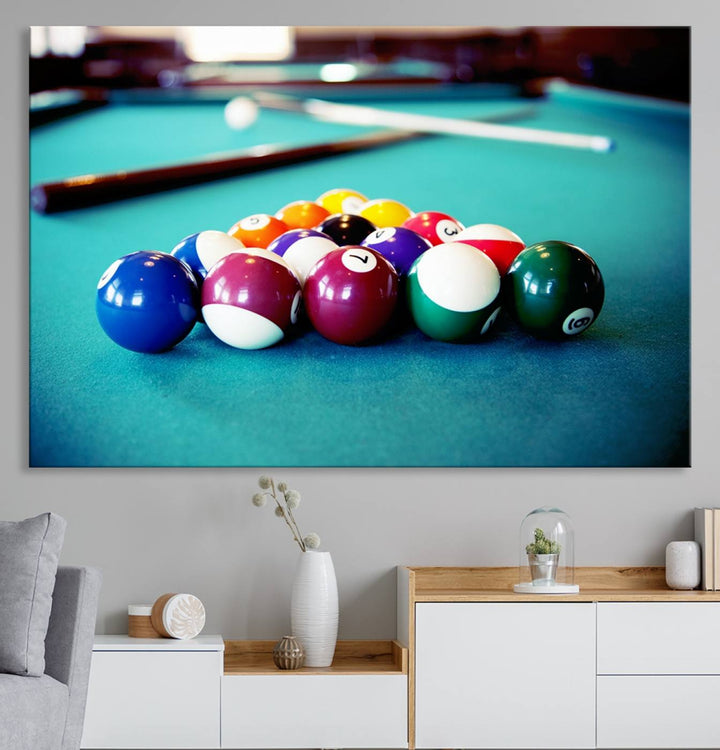 The Billiard Balls Pool Table Wall Art, a handmade piece, features cues on a blue table.