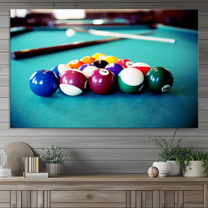 The Billiard Balls Pool Table Wall Art, a handmade piece, features cues on a blue table.