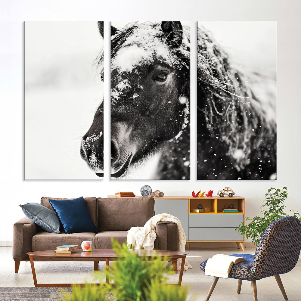 A black and white horse wall art piece, designed in a farmhouse and western decor style, is beautifully displayed as a ready-to-hang framed giclee canvas print in a warmly lit living room.