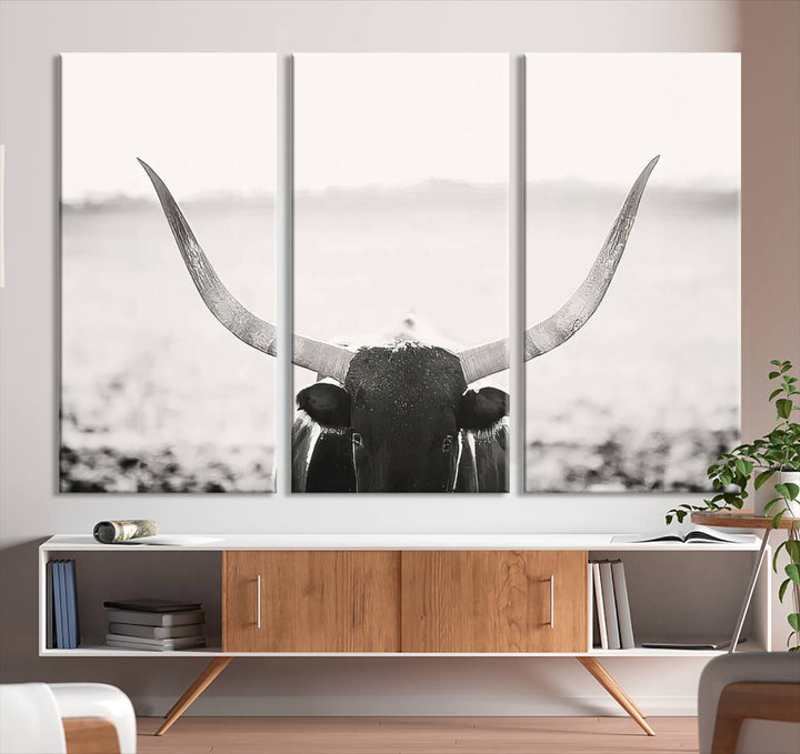 A captivating Black and White Longhorn Wall Art, featuring a triptych of a bull with impressive horns, perfectly suits those who admire Western Longhorn Canvas Prints. This ready-to-hang and framed piece beautifully merges farmhouse wall art with contemporary style.