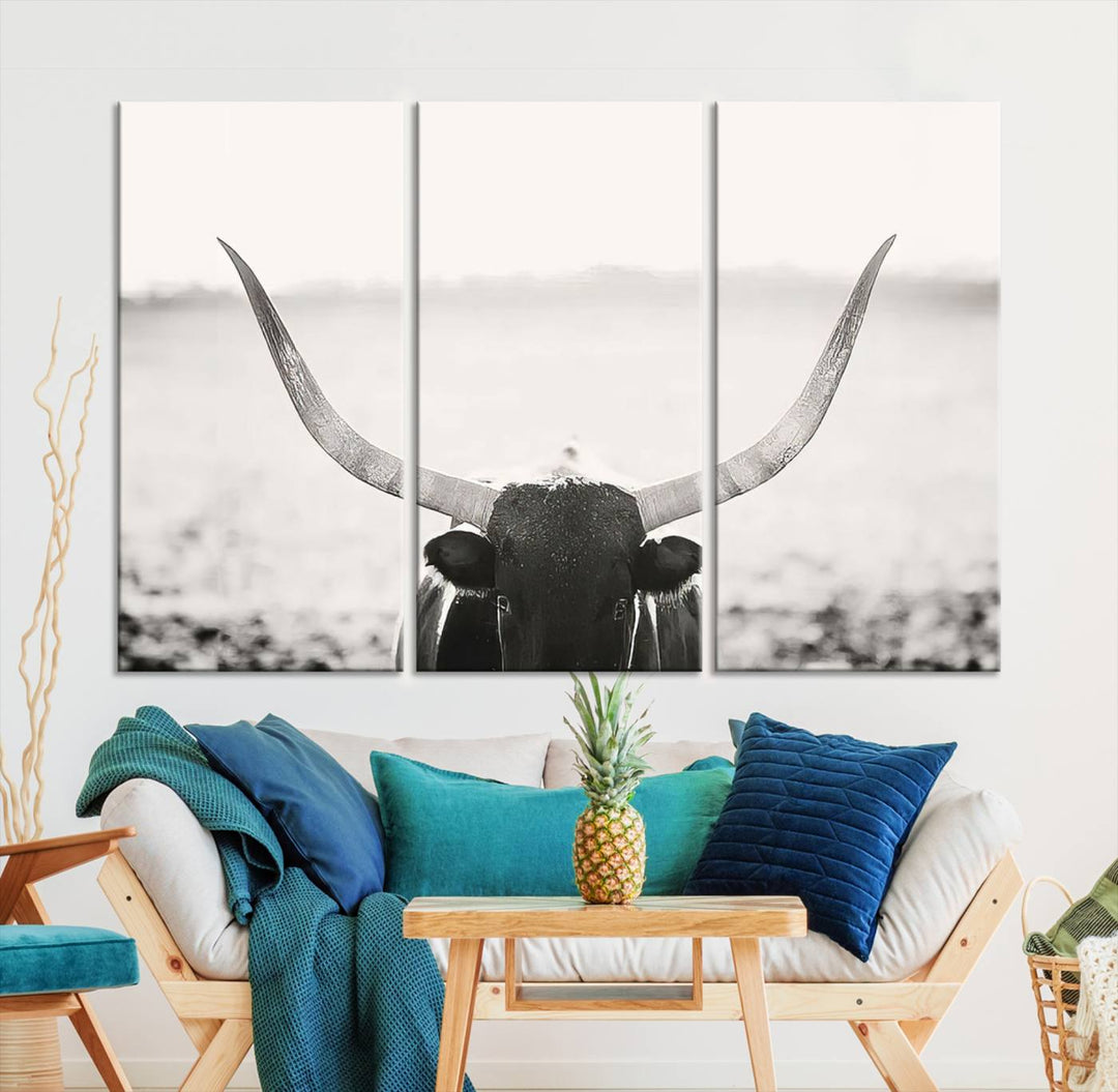 A captivating Black and White Longhorn Wall Art, featuring a triptych of a bull with impressive horns, perfectly suits those who admire Western Longhorn Canvas Prints. This ready-to-hang and framed piece beautifully merges farmhouse wall art with contemporary style.