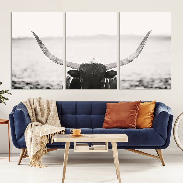 A captivating Black and White Longhorn Wall Art, featuring a triptych of a bull with impressive horns, perfectly suits those who admire Western Longhorn Canvas Prints. This ready-to-hang and framed piece beautifully merges farmhouse wall art with contemporary style.