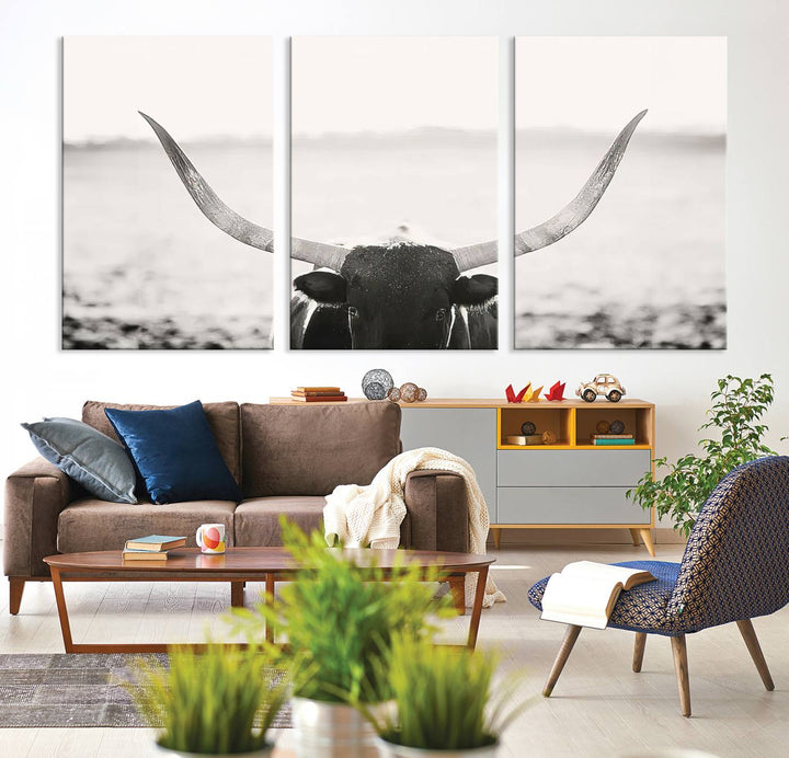 A captivating Black and White Longhorn Wall Art, featuring a triptych of a bull with impressive horns, perfectly suits those who admire Western Longhorn Canvas Prints. This ready-to-hang and framed piece beautifully merges farmhouse wall art with contemporary style.