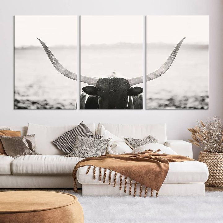 A captivating Black and White Longhorn Wall Art, featuring a triptych of a bull with impressive horns, perfectly suits those who admire Western Longhorn Canvas Prints. This ready-to-hang and framed piece beautifully merges farmhouse wall art with contemporary style.