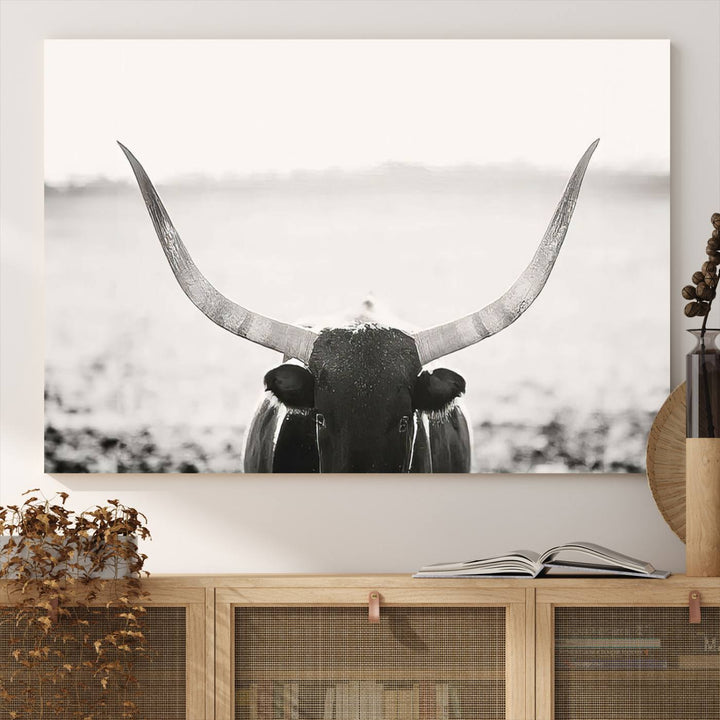 A captivating Black and White Longhorn Wall Art, featuring a triptych of a bull with impressive horns, perfectly suits those who admire Western Longhorn Canvas Prints. This ready-to-hang and framed piece beautifully merges farmhouse wall art with contemporary style.