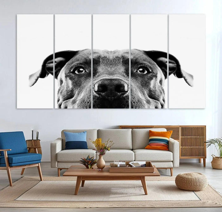 The "Black and White Pit Bull Dog Wall Art Canvas Print" elegantly adorns the living room, infusing character and charm into the contemporary setting. This captivating piece is perfect for dog lovers.