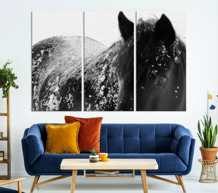 The "Black Horse in Snow Canvas Print" serves as an ideal rustic cabin wall art centerpiece with its triptych design of a snowy black horse.