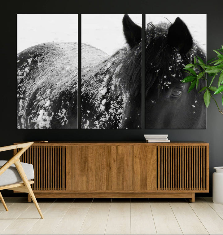 The "Black Horse in Snow Canvas Print" serves as an ideal rustic cabin wall art centerpiece with its triptych design of a snowy black horse.