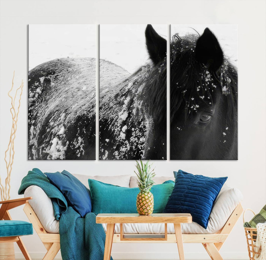 The "Black Horse in Snow Canvas Print" serves as an ideal rustic cabin wall art centerpiece with its triptych design of a snowy black horse.