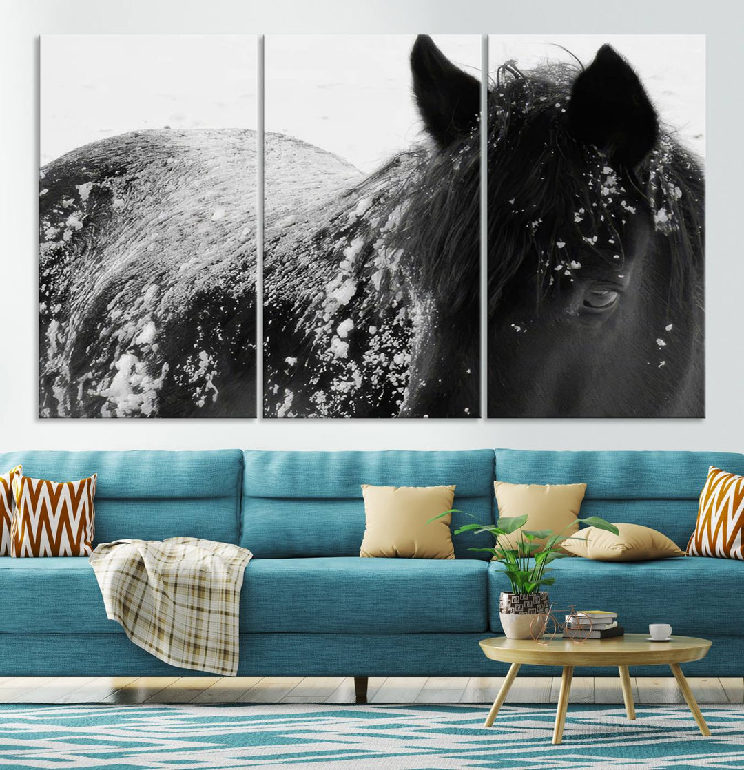 The "Black Horse in Snow Canvas Print" serves as an ideal rustic cabin wall art centerpiece with its triptych design of a snowy black horse.