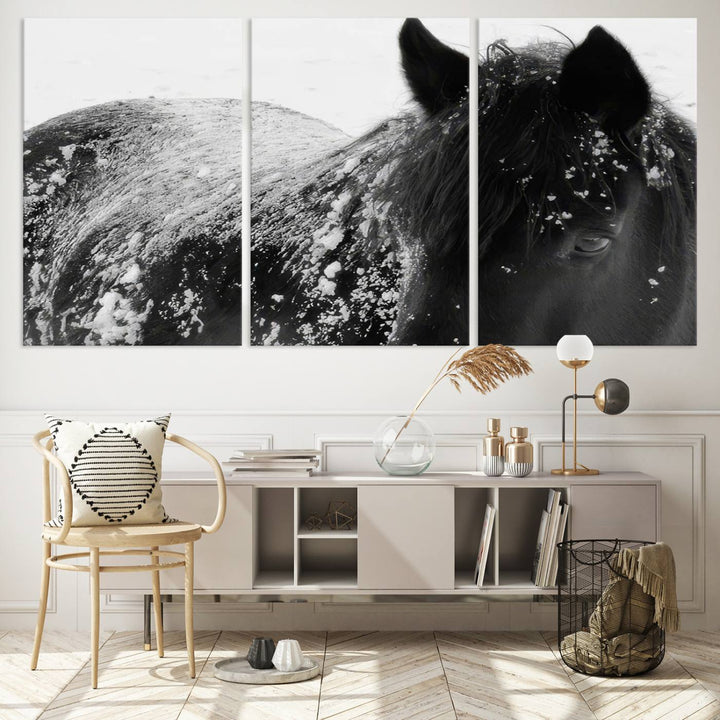 The "Black Horse in Snow Canvas Print" serves as an ideal rustic cabin wall art centerpiece with its triptych design of a snowy black horse.