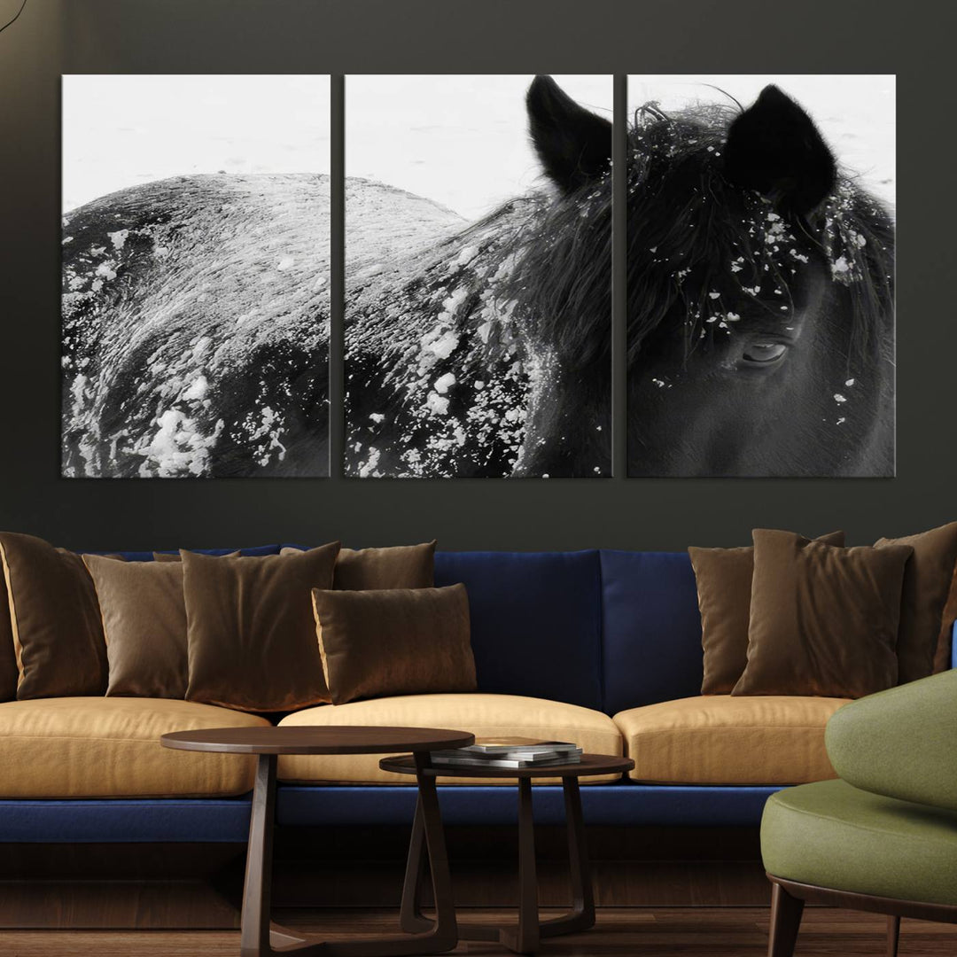 The "Black Horse in Snow Canvas Print" serves as an ideal rustic cabin wall art centerpiece with its triptych design of a snowy black horse.