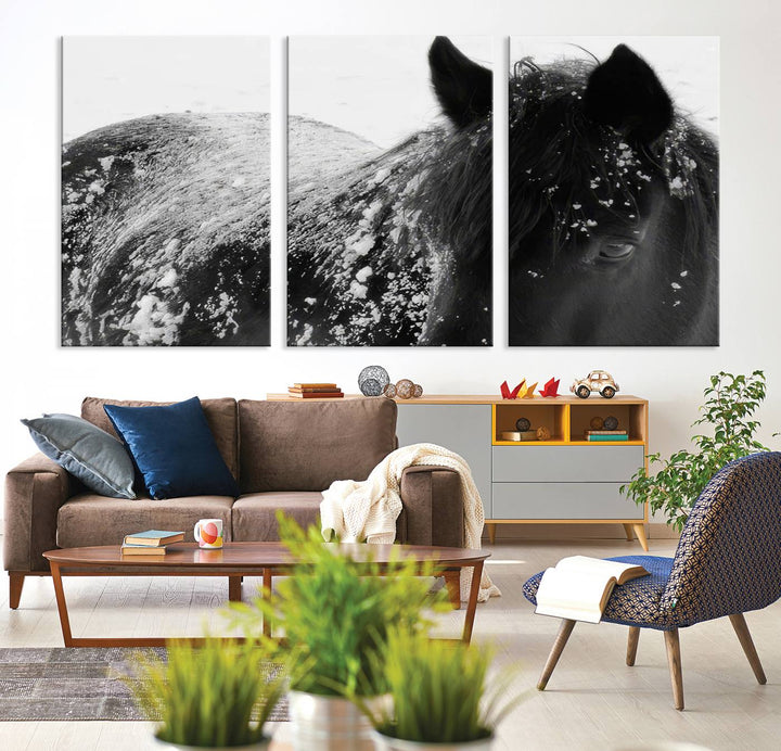 The "Black Horse in Snow Canvas Print" serves as an ideal rustic cabin wall art centerpiece with its triptych design of a snowy black horse.