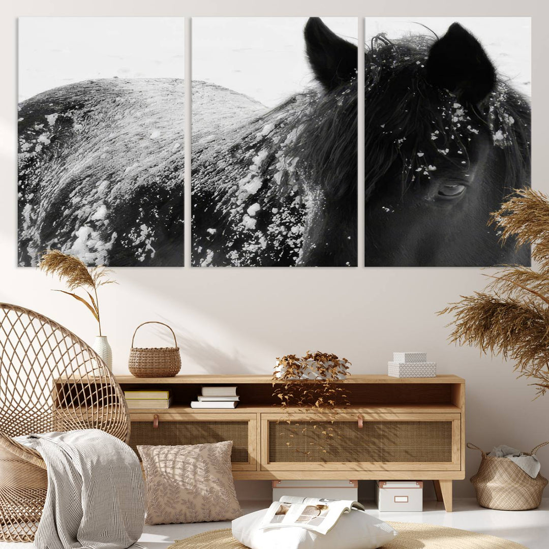 The "Black Horse in Snow Canvas Print" serves as an ideal rustic cabin wall art centerpiece with its triptych design of a snowy black horse.