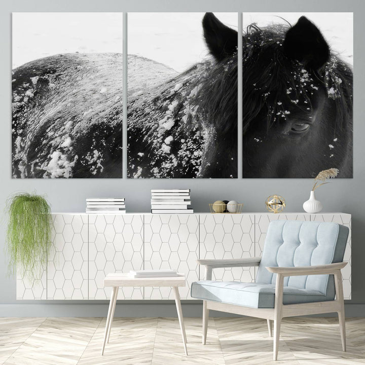 The "Black Horse in Snow Canvas Print" serves as an ideal rustic cabin wall art centerpiece with its triptych design of a snowy black horse.