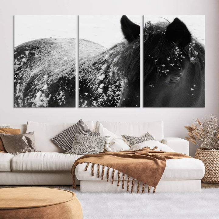 The "Black Horse in Snow Canvas Print" serves as an ideal rustic cabin wall art centerpiece with its triptych design of a snowy black horse.