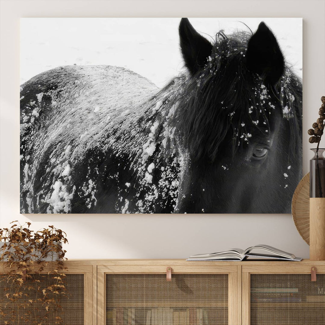 The "Black Horse in Snow Canvas Print" serves as an ideal rustic cabin wall art centerpiece with its triptych design of a snowy black horse.