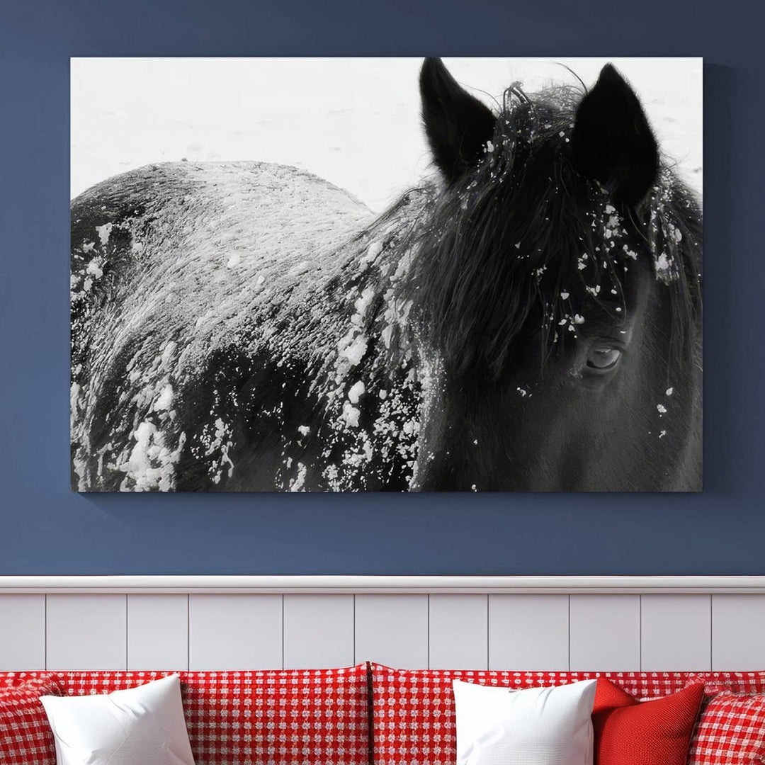 The "Black Horse in Snow Canvas Print" serves as an ideal rustic cabin wall art centerpiece with its triptych design of a snowy black horse.