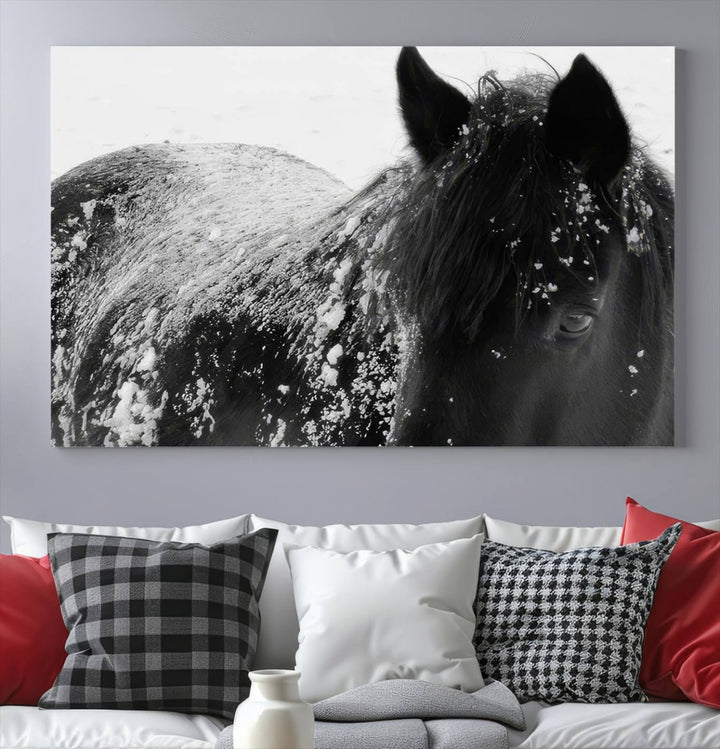 The "Black Horse in Snow Canvas Print" serves as an ideal rustic cabin wall art centerpiece with its triptych design of a snowy black horse.