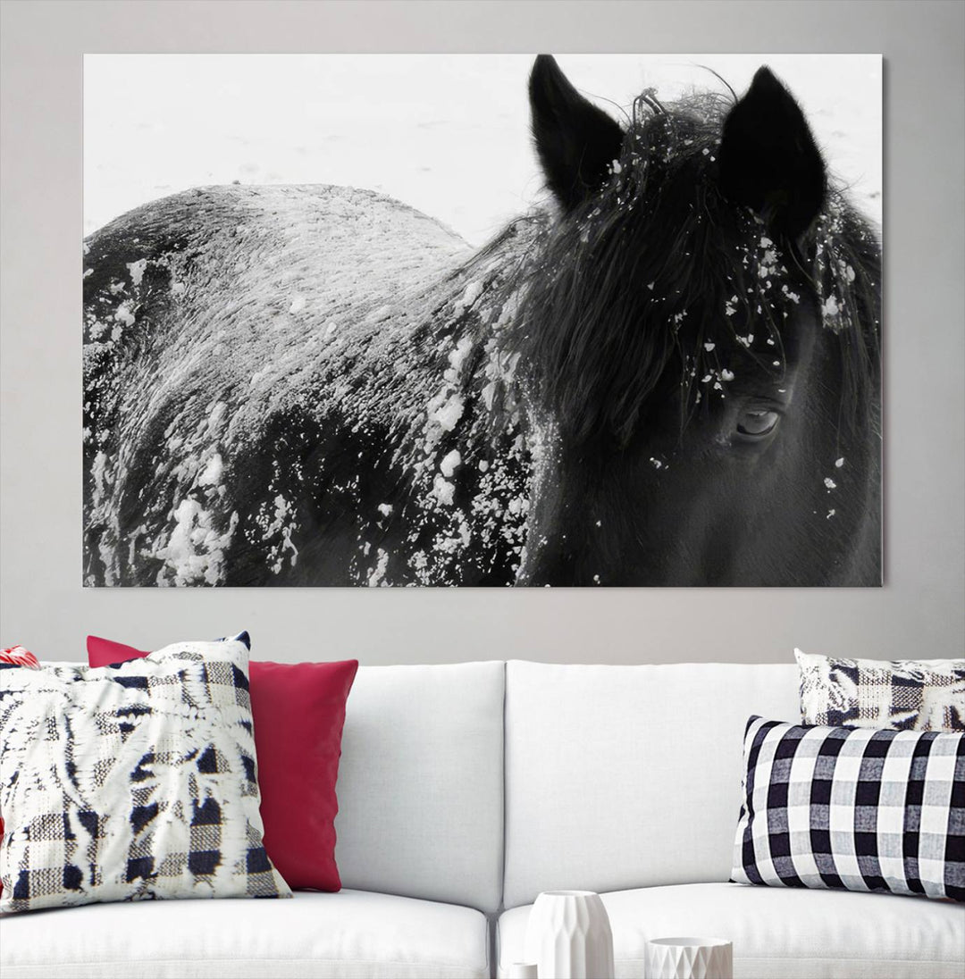 The "Black Horse in Snow Canvas Print" serves as an ideal rustic cabin wall art centerpiece with its triptych design of a snowy black horse.