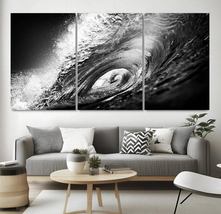 A three-panel display of the "Black Ocean Wave at Sunset Canvas Art" features a vibrant depiction of water waves in black and white, perfectly capturing the coastal ambiance.