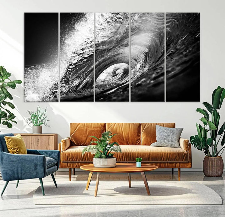 A three-panel display of the "Black Ocean Wave at Sunset Canvas Art" features a vibrant depiction of water waves in black and white, perfectly capturing the coastal ambiance.