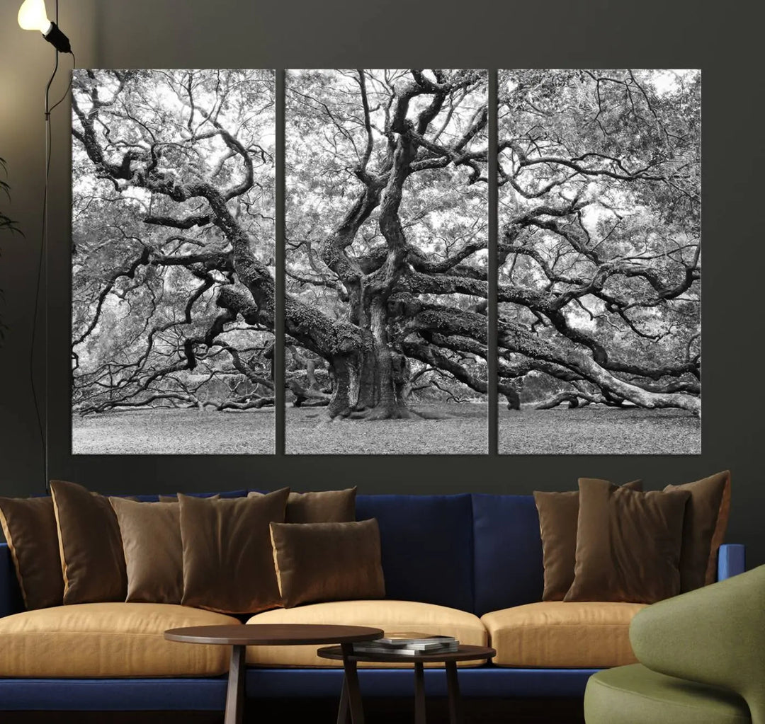 The timeless nature-inspired Black White Angel Oak Tree Wall Art beautifully adorns a modern living room as a triptych. Creating a harmonious blend of style and serenity, this piece elegantly infuses the space with its striking imagery.