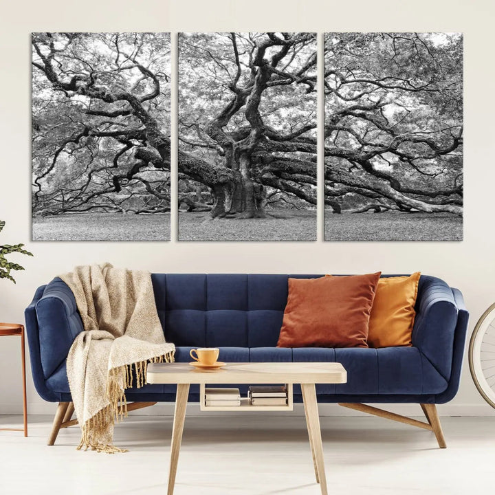 The timeless nature-inspired Black White Angel Oak Tree Wall Art beautifully adorns a modern living room as a triptych. Creating a harmonious blend of style and serenity, this piece elegantly infuses the space with its striking imagery.