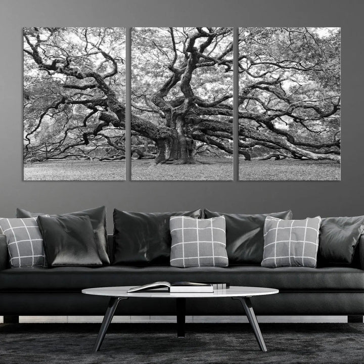 The timeless nature-inspired Black White Angel Oak Tree Wall Art beautifully adorns a modern living room as a triptych. Creating a harmonious blend of style and serenity, this piece elegantly infuses the space with its striking imagery.