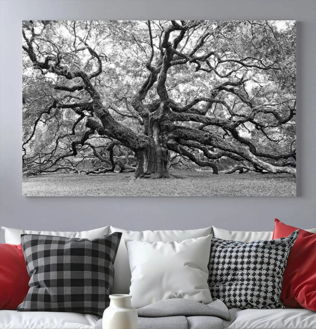 The timeless nature-inspired Black White Angel Oak Tree Wall Art beautifully adorns a modern living room as a triptych. Creating a harmonious blend of style and serenity, this piece elegantly infuses the space with its striking imagery.