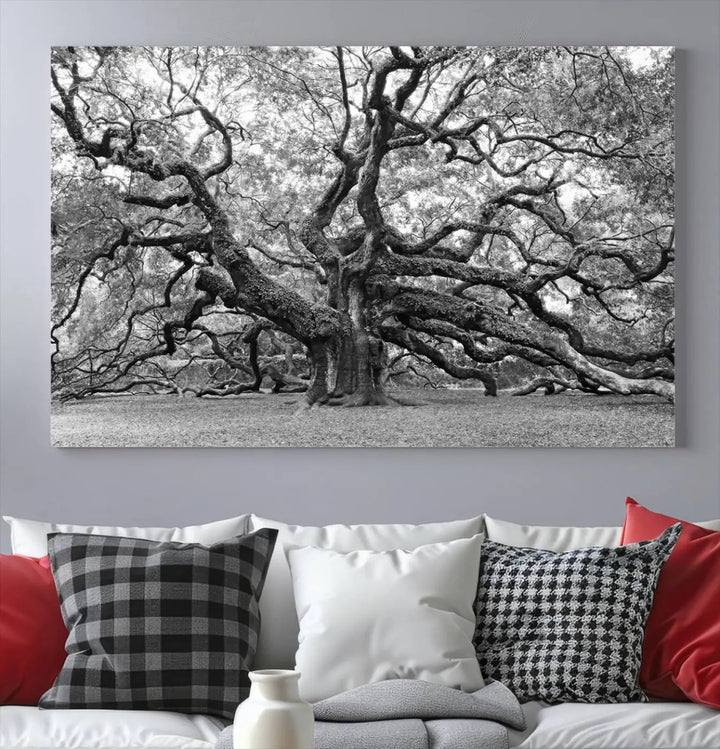 The timeless nature-inspired Black White Angel Oak Tree Wall Art beautifully adorns a modern living room as a triptych. Creating a harmonious blend of style and serenity, this piece elegantly infuses the space with its striking imagery.