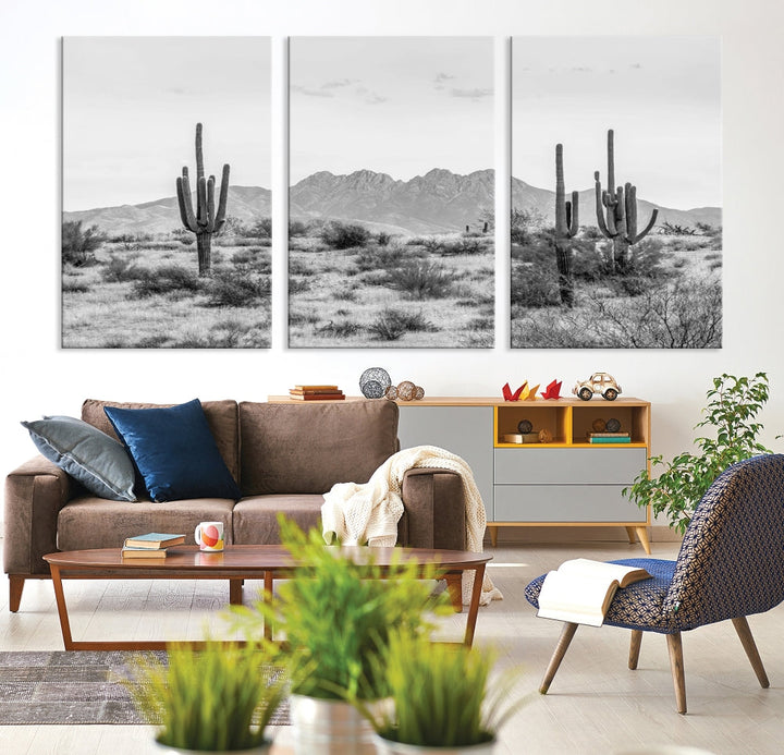 The modern living room showcases the "Black White Arizona Desert Canvas Wall Art Cactus Farmhouse Wall Art," a triptych consisting of gallery-wrapped, museum-quality black-and-white desert landscape photographs featuring cacti.