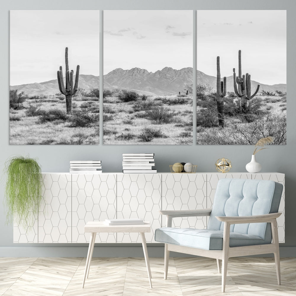 The modern living room showcases the "Black White Arizona Desert Canvas Wall Art Cactus Farmhouse Wall Art," a triptych consisting of gallery-wrapped, museum-quality black-and-white desert landscape photographs featuring cacti.