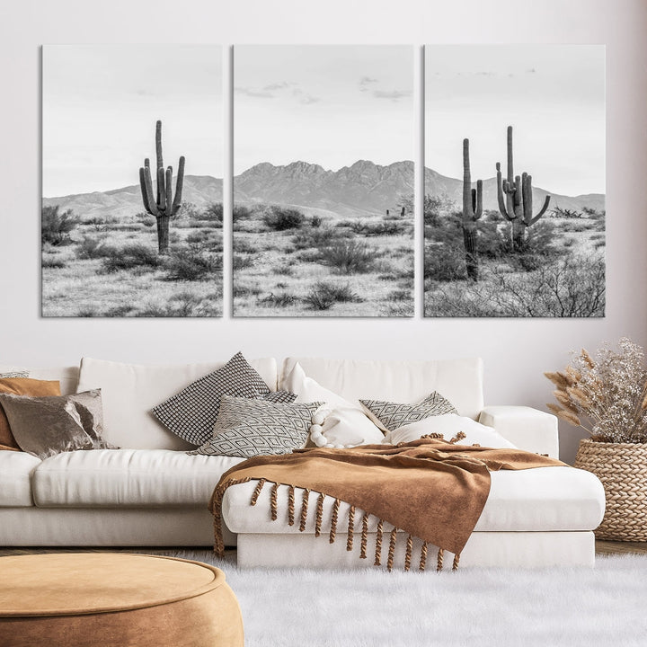 The modern living room showcases the "Black White Arizona Desert Canvas Wall Art Cactus Farmhouse Wall Art," a triptych consisting of gallery-wrapped, museum-quality black-and-white desert landscape photographs featuring cacti.